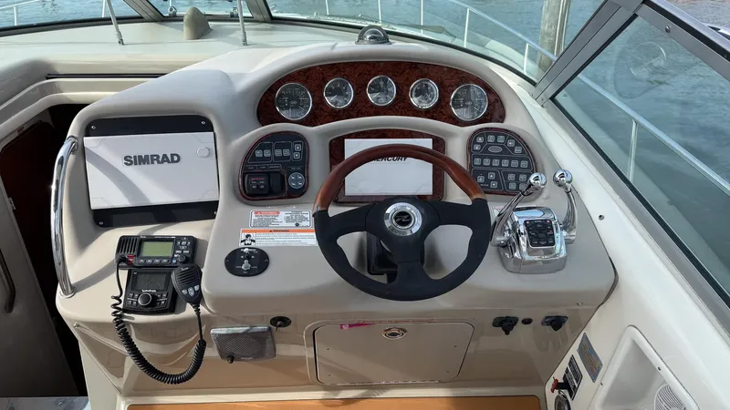  Yacht Photos Pics Helm of 2008 Sea Ray 340 Sundancer with steering wheel and navigation controls.