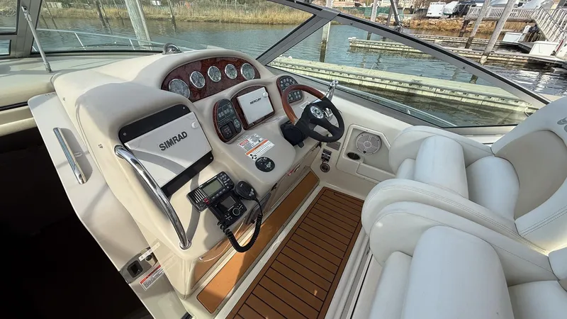  Yacht Photos Pics 2008 Sea Ray 340 Sundancer helm with modern controls and wood accents.