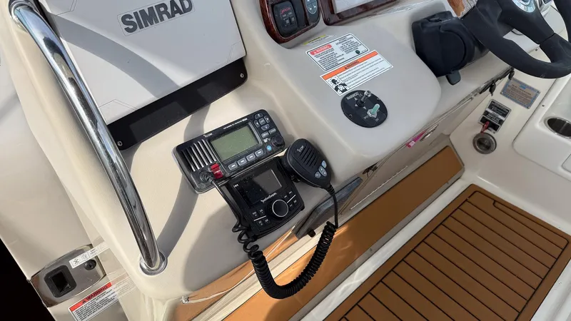  Yacht Photos Pics Control panel of 2008 Sea Ray 340 Sundancer with Simrad electronics and marine radio.