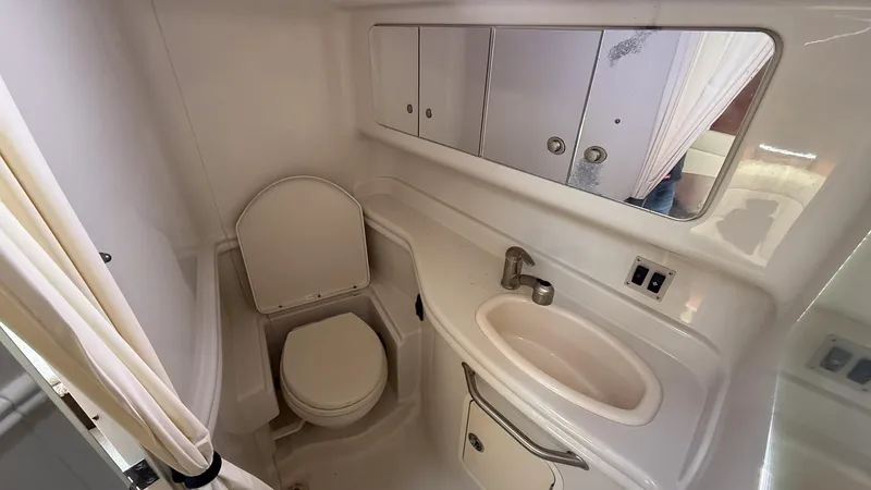  Yacht Photos Pics 2008 Sea Ray 340 Sundancer bathroom with toilet, sink, and mirror.