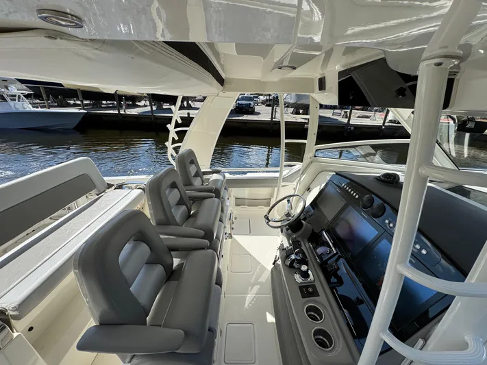  Yacht Photos Pics Interior view of 2016 Boston Whaler 420 Outrage boat with modern helm and seating.