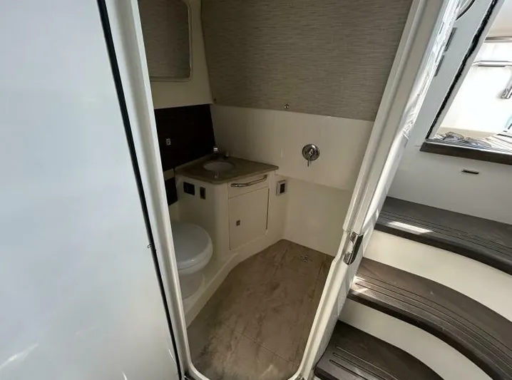  Yacht Photos Pics Interior of 2016 Boston Whaler 420 Outrage boat bathroom with sink and toilet.