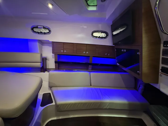  Yacht Photos Pics Interior of 2018 Boston Whaler 345 Conquest with blue ambient lighting and modern seating.