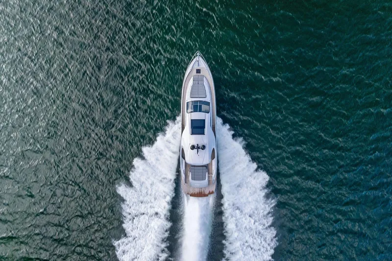 Niki Yacht Photos Pics Aerial view of 2024 Pershing 7X yacht cruising on open water.