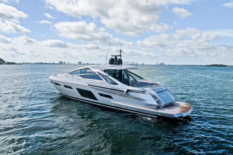 Niki Yacht Photos Pics 2024 Pershing 7X yacht cruising on open water under a partly cloudy sky.