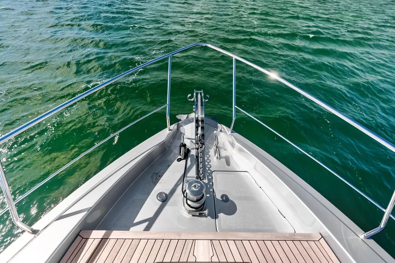 Niki Yacht Photos Pics Bow of 2024 Pershing 7X yacht on open water, featuring sleek design and railing.