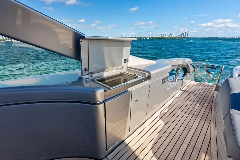 Niki Yacht Photos Pics Luxury deck of 2024 Pershing 7X yacht with ocean view and sleek design.