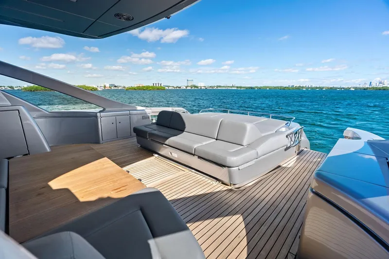 Niki Yacht Photos Pics Luxurious 2024 Pershing 7X yacht deck with sleek seating and ocean view.