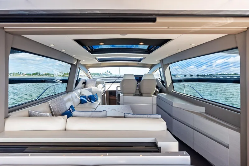 Niki Yacht Photos Pics Luxurious interior of 2024 Pershing 7X yacht with modern seating and panoramic windows.