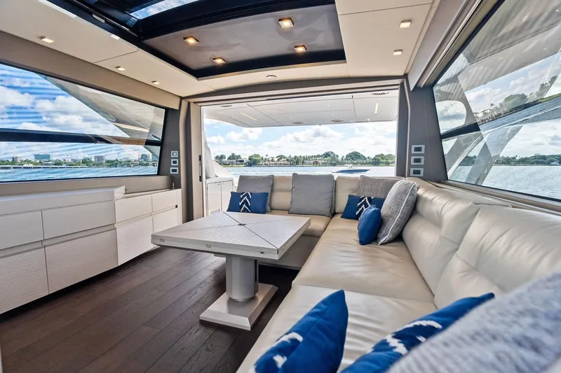 Niki Yacht Photos Pics Luxurious interior of 2024 Pershing 7X yacht with plush seating and scenic views.
