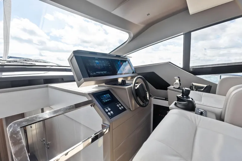 Niki Yacht Photos Pics 2024 Pershing 7X yacht helm with modern controls and panoramic windows.