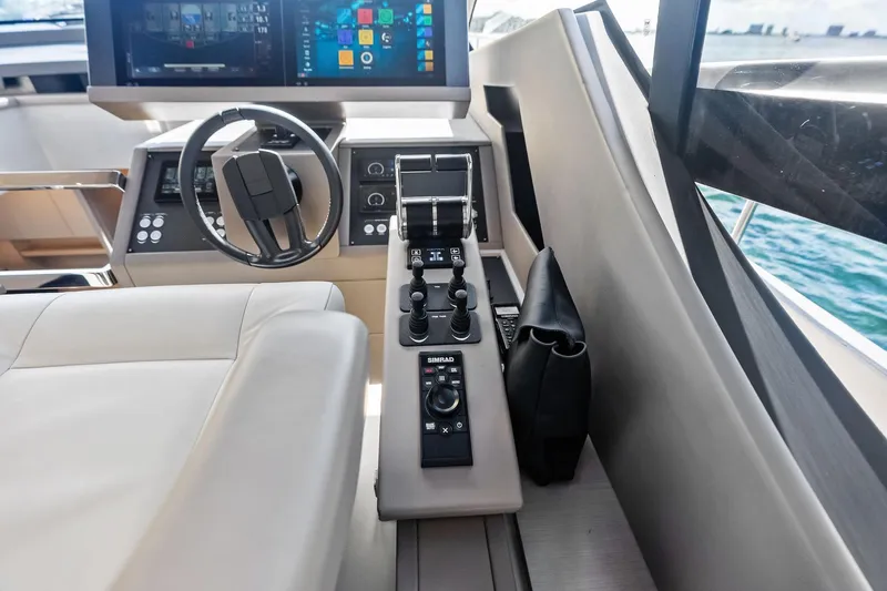 Niki Yacht Photos Pics 2024 Pershing 7X yacht cockpit with modern steering and control panel.