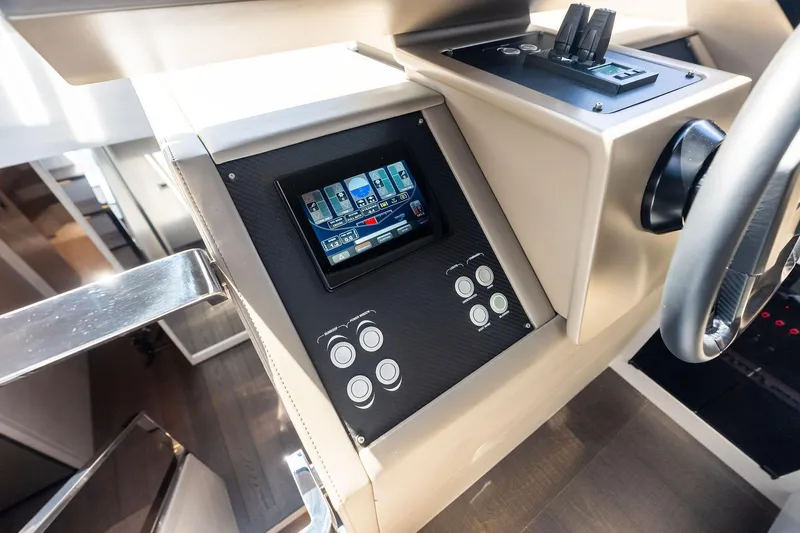 Niki Yacht Photos Pics 2024 Pershing 7X yacht dashboard with touchscreen controls and steering wheel.