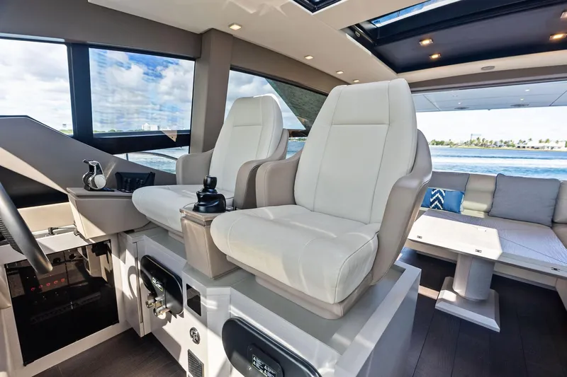 Niki Yacht Photos Pics Luxurious interior of 2024 Pershing 7X yacht with plush seating and modern design.