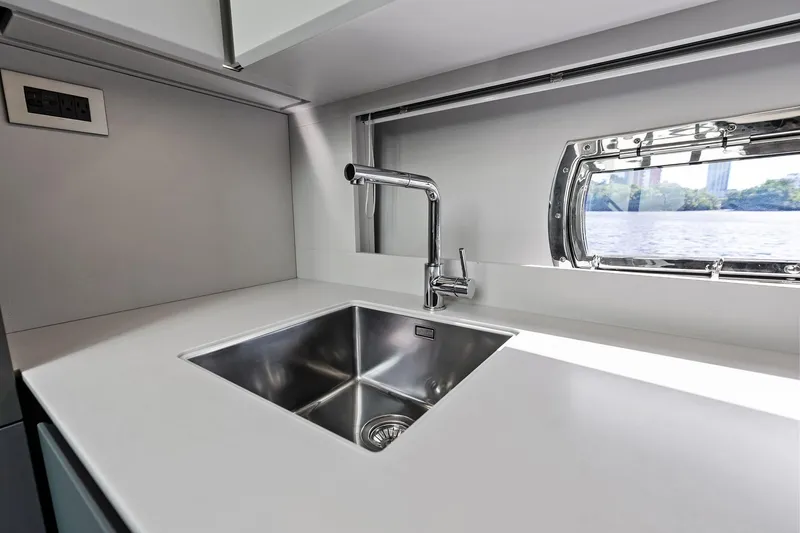 Niki Yacht Photos Pics Modern kitchen sink in 2024 Pershing 7X yacht, featuring sleek design and ocean view.