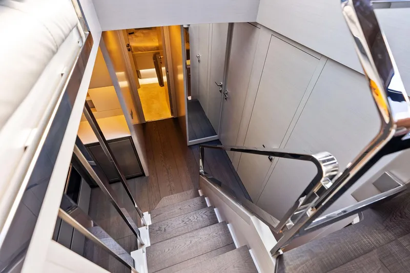 Niki Yacht Photos Pics Luxurious interior staircase of 2024 Pershing 7X yacht, featuring sleek design and modern finishes.