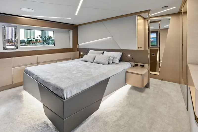 Niki Yacht Photos Pics Luxurious bedroom interior of 2024 Pershing 7X yacht with modern design and elegant furnishings.