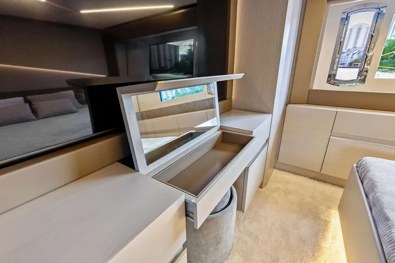 Niki Yacht Photos Pics Luxurious interior of 2024 Pershing 7X yacht with modern vanity and window view.