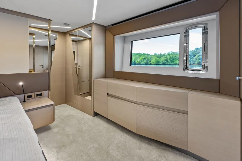 Niki Yacht Photos Pics Luxurious interior of 2024 Pershing 7X yacht with modern design and scenic window view.