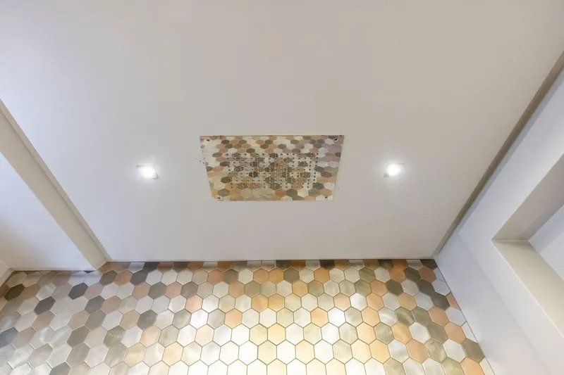 Niki Yacht Photos Pics Ceiling view of Pershing 7X 2024 with hexagonal tiles and recessed lighting.