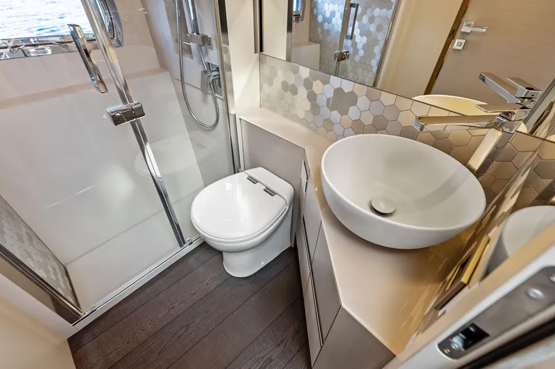 Niki Yacht Photos Pics Luxurious bathroom in 2024 Pershing 7X yacht with modern fixtures and elegant design.