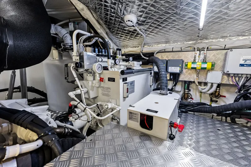 Niki Yacht Photos Pics Engine room of 2024 Pershing 7X yacht with advanced mechanical systems and wiring.