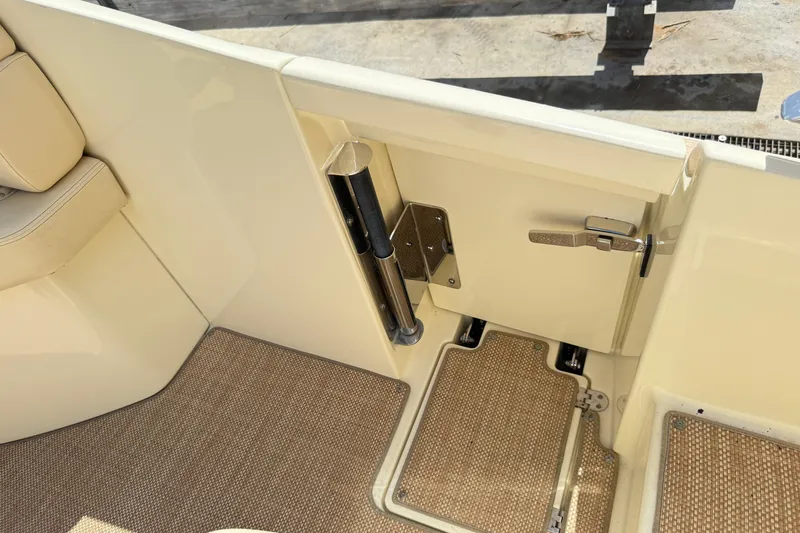  Yacht Photos Pics 2019 Chris-Craft Launch 28 GT interior detail with beige seating and carpeted flooring.