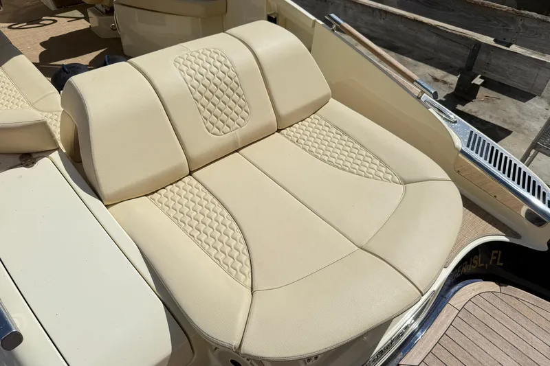  Yacht Photos Pics 2019 Chris-Craft Launch 28 GT boat with beige cushioned seating and elegant design.