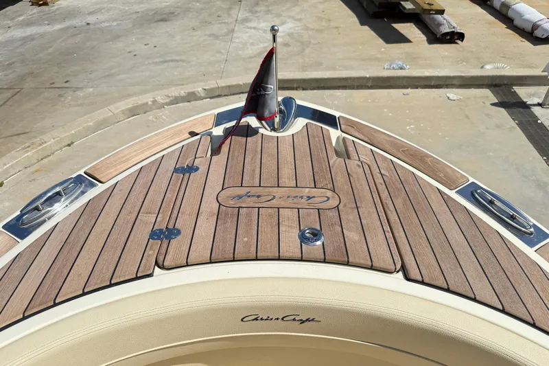  Yacht Photos Pics 2019 Chris-Craft Launch 28 GT boat with teak deck and flag at the bow.