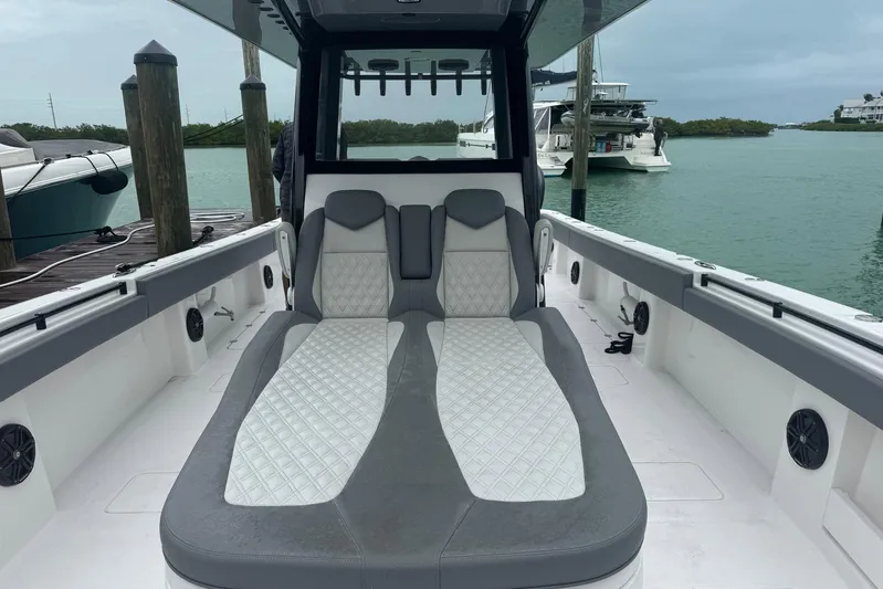  Yacht Photos Pics 2025 Invincible 35 Catamaran interior with luxurious seating, docked by the water.