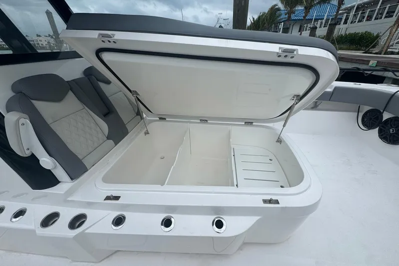  Yacht Photos Pics Open storage compartment on 2025 Invincible 35 Catamaran, featuring sleek seating and modern design.