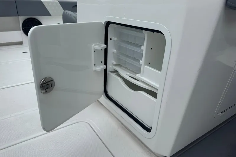  Yacht Photos Pics Open storage compartment on 2025 Invincible 35 Catamaran boat interior.