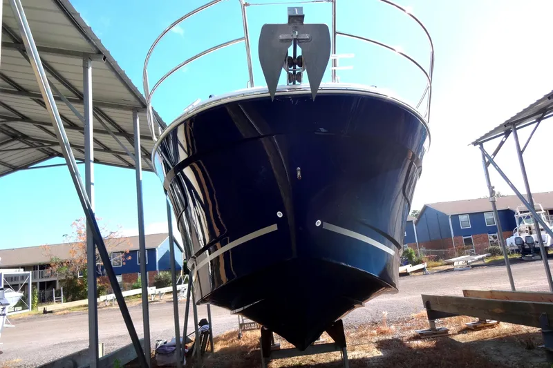 Blue Baby Yacht Photos Pics 2022 Jeanneau Merry Fisher 895 Offshore boat under shelter, front view.