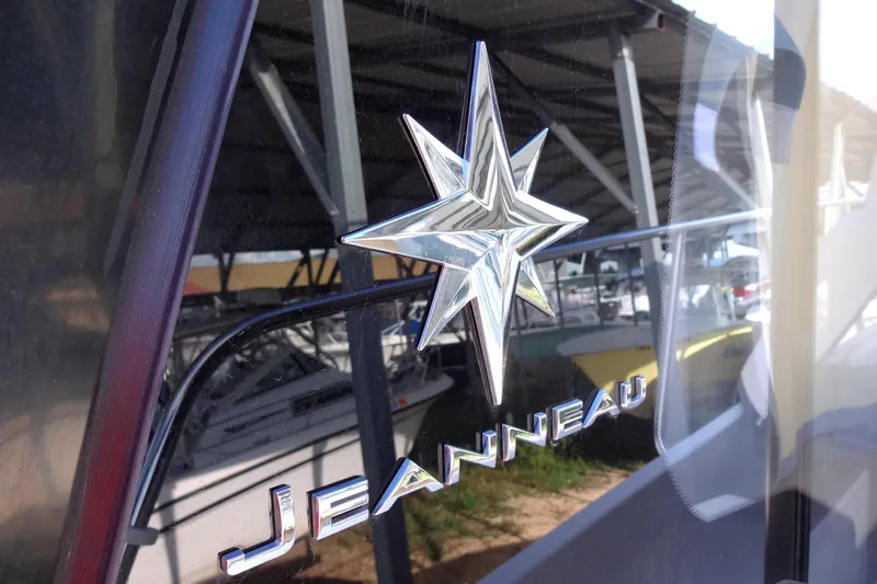 Blue Baby Yacht Photos Pics 2022 Jeanneau Merry Fisher 895 Offshore logo on boat exterior.