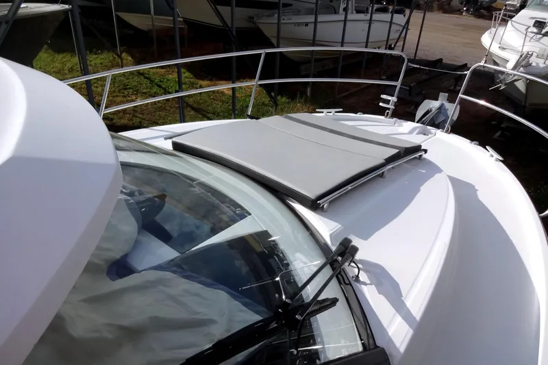 Blue Baby Yacht Photos Pics 2022 Jeanneau Merry Fisher 895 Offshore boat deck with sunpad and railing.