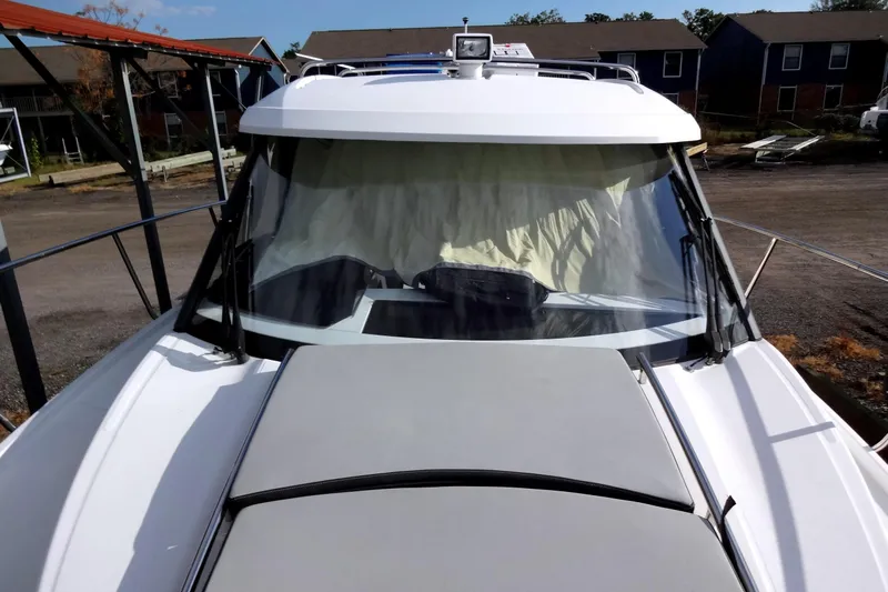 Blue Baby Yacht Photos Pics 2022 Jeanneau Merry Fisher 895 Offshore boat, front view with windshield and deck.