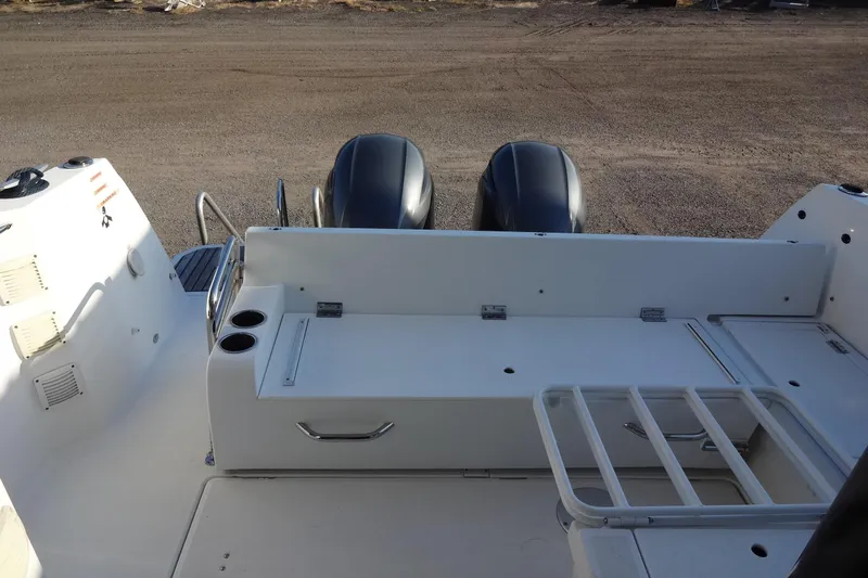 Blue Baby Yacht Photos Pics 2022 Jeanneau Merry Fisher 895 Offshore boat deck with twin engines and seating area.