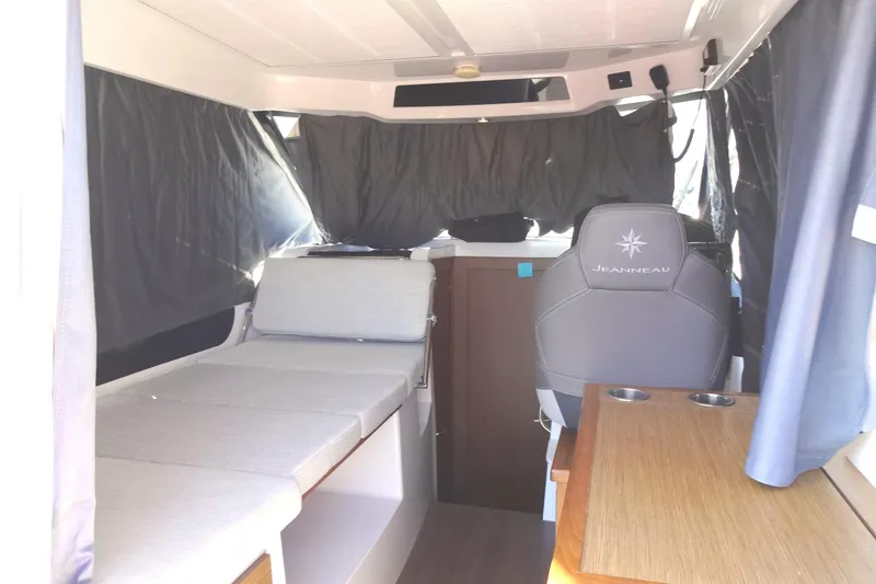 Blue Baby Yacht Photos Pics Interior of 2022 Jeanneau Merry Fisher 895 Offshore, featuring seating and helm area.