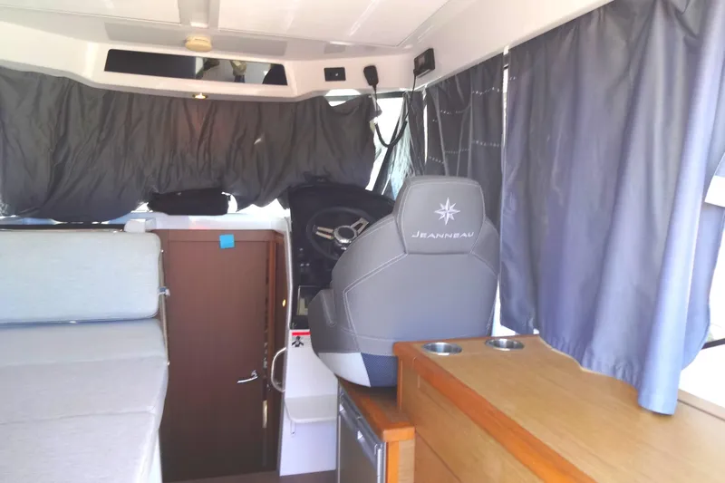 Blue Baby Yacht Photos Pics Interior of 2022 Jeanneau Merry Fisher 895 Offshore boat with helm and seating area.