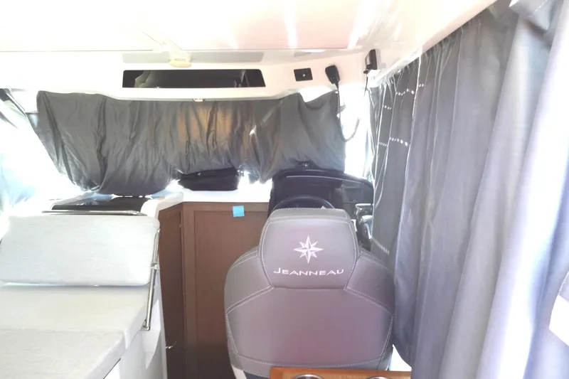 Blue Baby Yacht Photos Pics Interior of 2022 Jeanneau Merry Fisher 895 Offshore boat with helm and seating area.