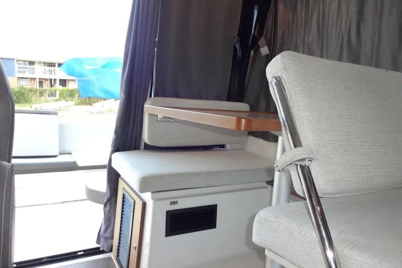Blue Baby Yacht Photos Pics Interior of 2022 Jeanneau Merry Fisher 895 Offshore, featuring seating and table.