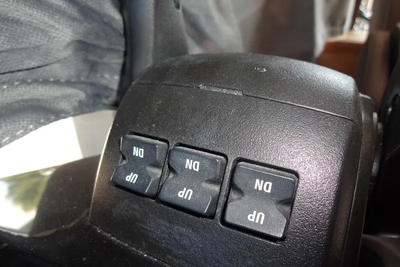 Blue Baby Yacht Photos Pics Control panel with "UP" and "DN" buttons on Jeanneau Merry Fisher 895 Offshore, 2022 model.