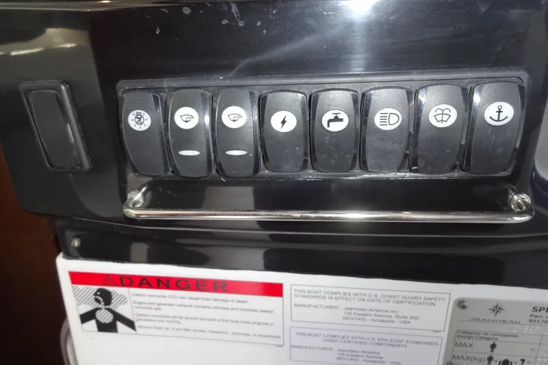Blue Baby Yacht Photos Pics Control panel of 2022 Jeanneau Merry Fisher 895 Offshore boat with labeled switches.