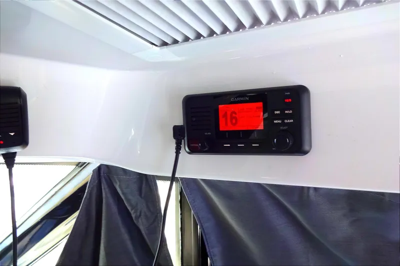 Blue Baby Yacht Photos Pics Garmin radio system inside 2022 Jeanneau Merry Fisher 895 Offshore boat cabin.