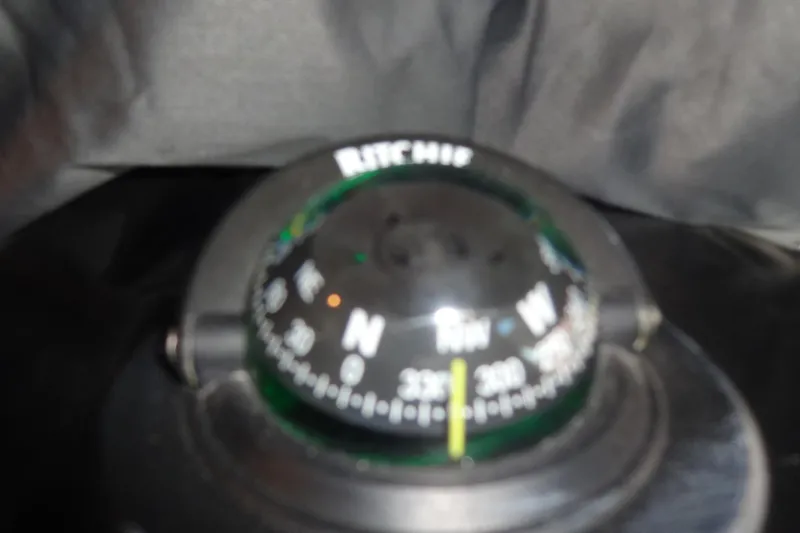 Blue Baby Yacht Photos Pics Compass on Jeanneau Merry Fisher 895 Offshore, 2022 model, showing navigation directions.