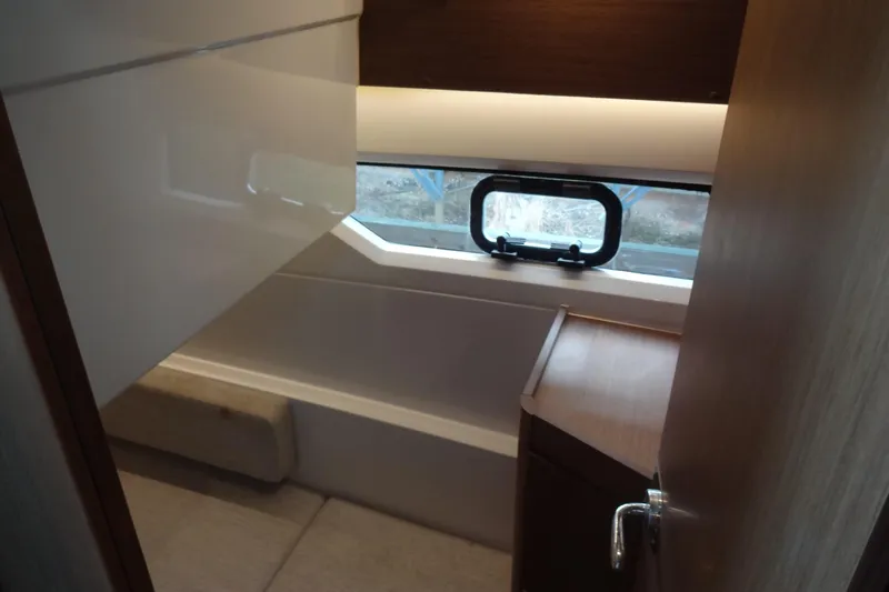 Blue Baby Yacht Photos Pics Interior of 2022 Jeanneau Merry Fisher 895 Offshore boat, featuring a compact bathroom.