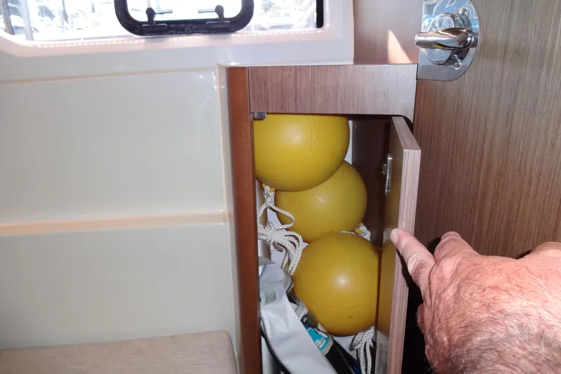 Blue Baby Yacht Photos Pics Storage compartment with yellow buoys on Jeanneau Merry Fisher 895 Offshore, 2022 model.