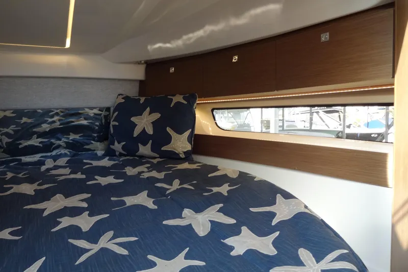 Blue Baby Yacht Photos Pics Interior cabin of 2022 Jeanneau Merry Fisher 895 Offshore with starfish bedding.