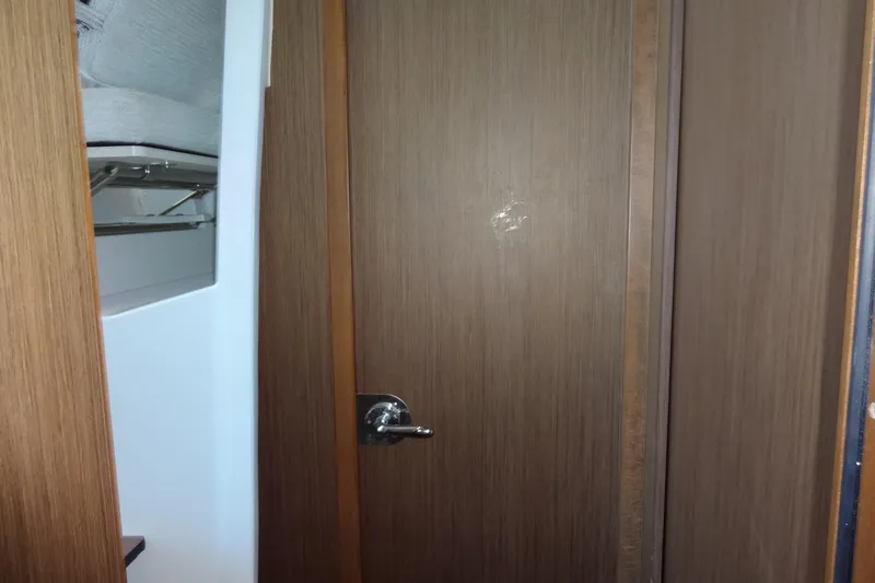 Blue Baby Yacht Photos Pics Interior cabin door of 2022 Jeanneau Merry Fisher 895 Offshore boat.