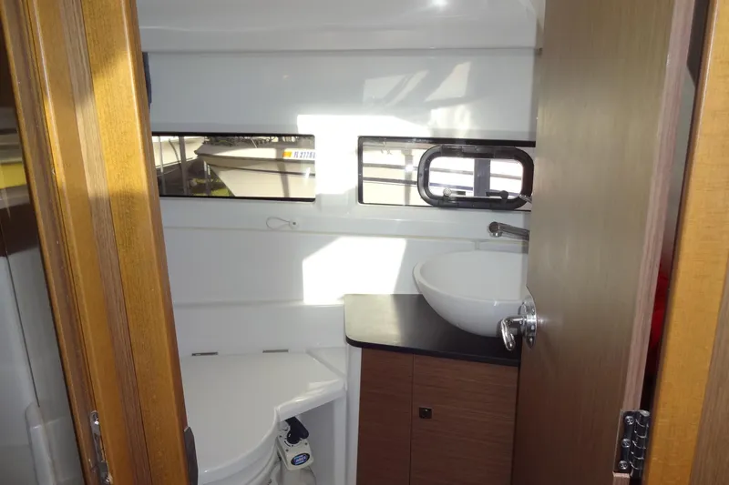 Blue Baby Yacht Photos Pics 2022 Jeanneau Merry Fisher 895 Offshore bathroom with sink and window.